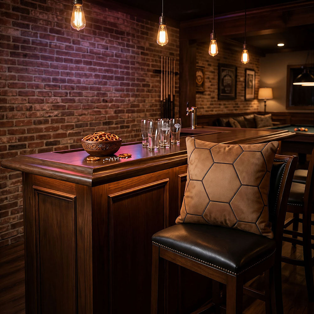 Brown hexagon soccer stitching custom cushion on retro brick wall sports bar stool, World Cup man cave & football pub decor pillow, customizable team name & fan photo for sports bar decoration.