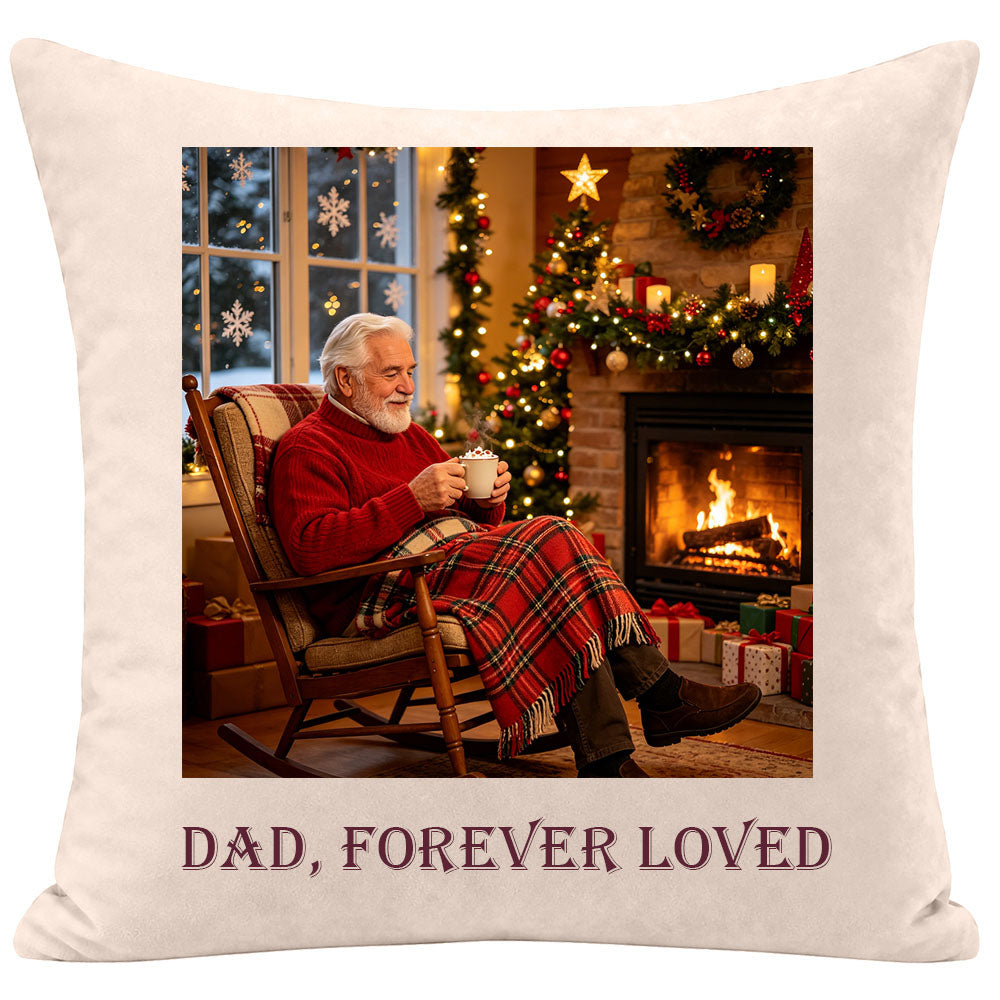 Memorial pillow for dad featuring a Christmas scene of an elderly man drinking hot cocoa by the fireplace, personalized with "Dad, Forever Loved", sympathy gift for remembering a father during the holidays, soft cream fabric keepsake.