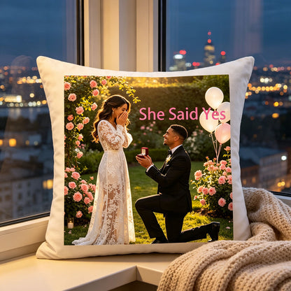 Custom engagement keepsake pillow placed on a windowsill overlooking a glowing city skyline at dusk. A romantic addition to evenings at home, celebrating the couple’s new chapter together.