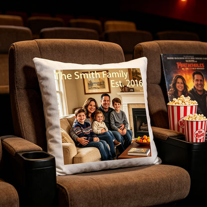 Custom family keepsake pillow placed on a plush home theater recliner, next to popcorn buckets. Great for adding personal warmth to your home cinema or media room.
