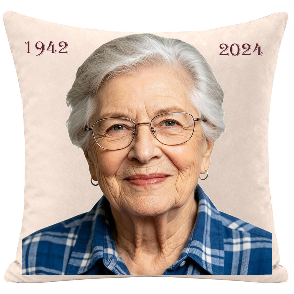 Personalized memorial throw pillow with a modern portrait of an elderly woman, featuring custom birth and passing years (1942-2024), sympathy keepsake for remembering a mother or grandmother, soft cream fabric.