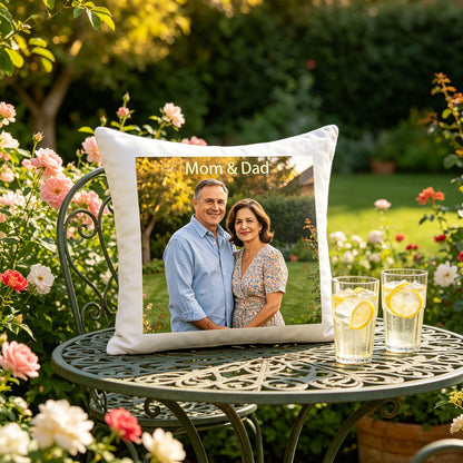 Custom Mom & Dad photo pillow placed on a vintage metal garden table, surrounded by blooming roses and lemonade glasses. A peaceful, summery touch perfect for celebrating parenthood in a daughter’s backyard.