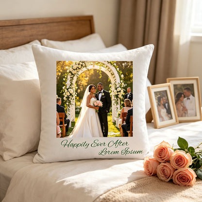 Custom wedding photo pillow placed on a sunlit master bedroom bed, surrounded by pink roses and framed wedding photos on the nightstand. A romantic, intimate touch celebrating the couple’s love story in their shared space.