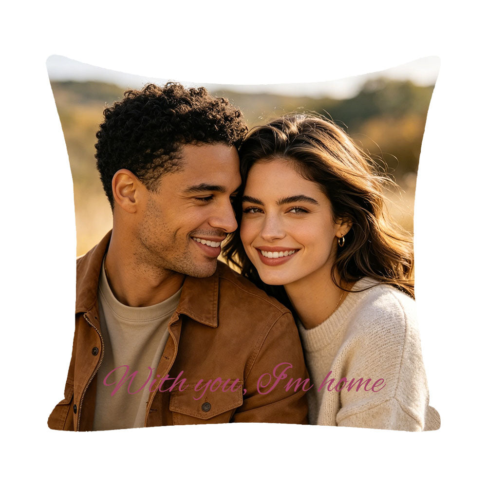 Personalized couple photo pillow with "With you, I'm home" text, couple leaning together in outdoor golden hour setting, romantic keepsake for couples, custom home decor