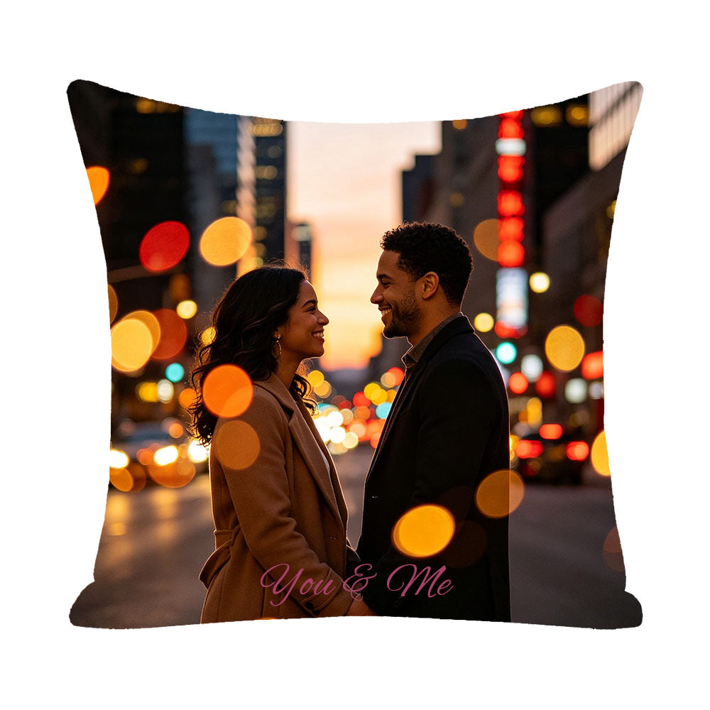 Personalized couple pillow with "You & Me" text, sunset city street bokeh background, Black couple smiling at each other, custom photo keepsake for couples, romantic home decor