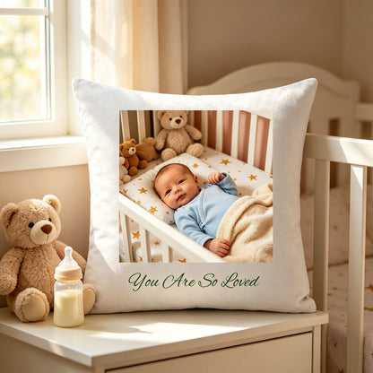 Custom newborn keepsake pillow resting on a white nursery nightstand, next to a plush teddy bear and baby bottle. A cozy, familiar touch showing the pillow as part of the baby’s daily nursery routine.
