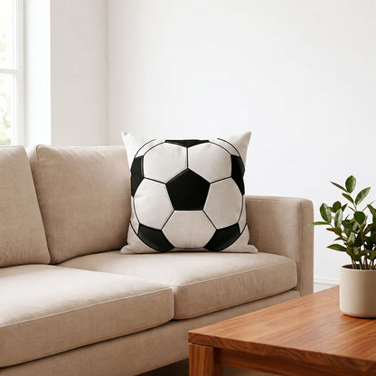Classic black white soccer print throw pillow placed on beige living room sofa, World Cup sports themed home decor cushion for football fan living space, customizable with your favorite team or player photo.